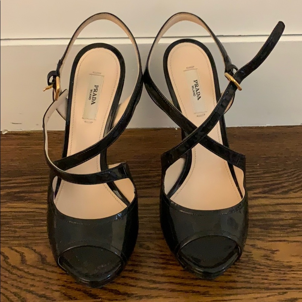 Prada black patent sandals.